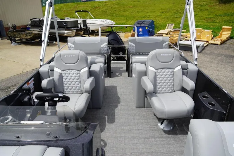 Slide: The Image of 2024 Crest Classic DLX 220 SLRC pontoon boat with luxurious seating. - 6