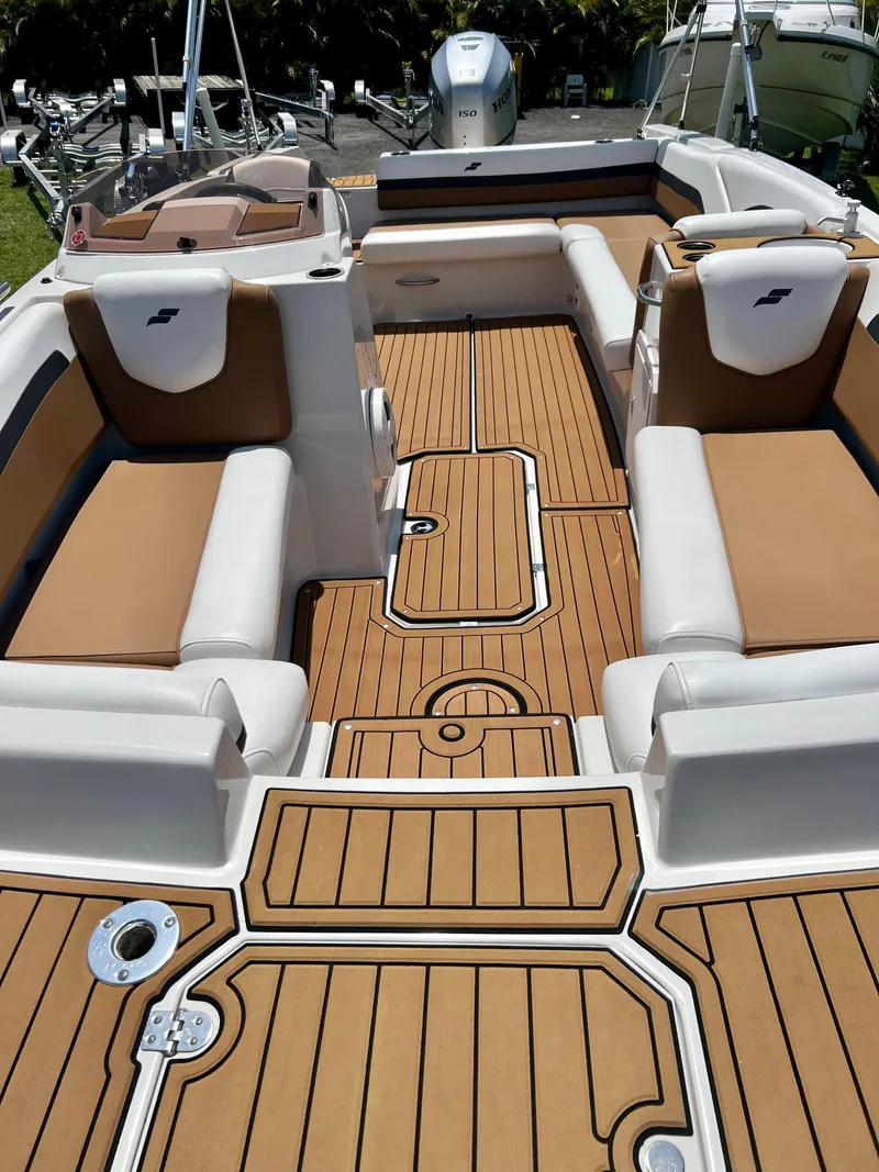 Slide: The Image of 2021 Starcraft 211 SVX boat interior with tan and white seating. - 7