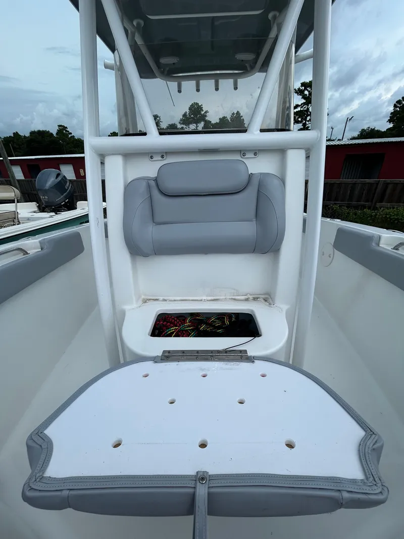 Slide: The Image of 2019 Sea Hunt 225 Ultra boat interior with seating and storage compartment. - 16