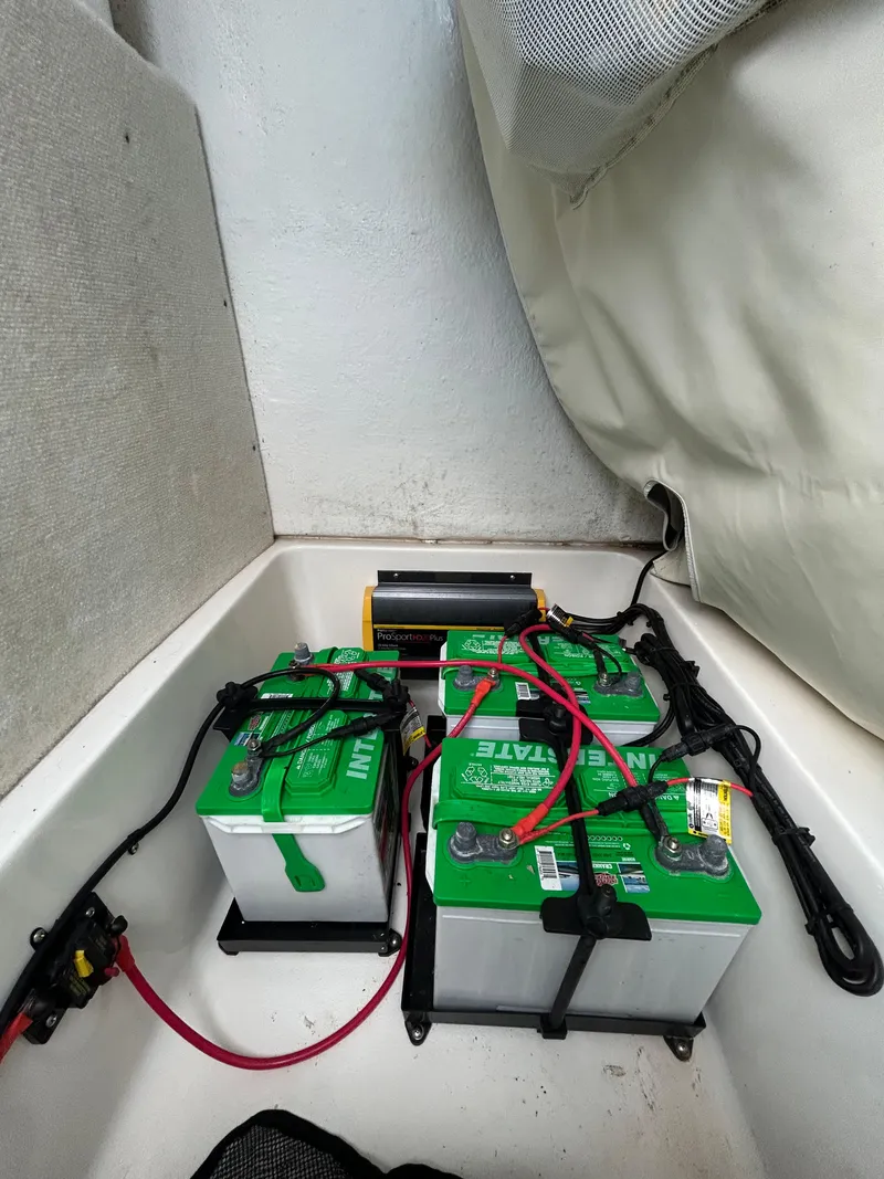 Slide: The Image of Batteries and wiring setup in a 2019 Sea Hunt 225 Ultra boat. - 25