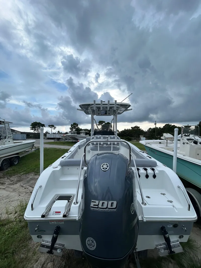 Slide: The Image of 2019 Sea Hunt 225 Ultra boat with Yamaha 200 engine under cloudy sky. - 5