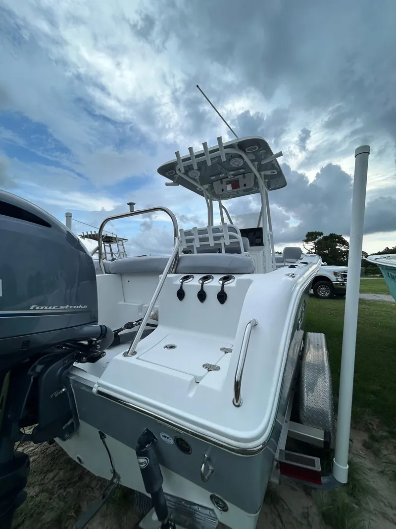Slide: The Image of 2019 Sea Hunt 225 Ultra boat with outboard motor under cloudy sky. - 8