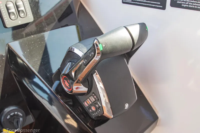 Slide: The Image of Throttle control of 2023 NX Boats 340 Sport Coupe, featuring sleek design and modern technology. - 17