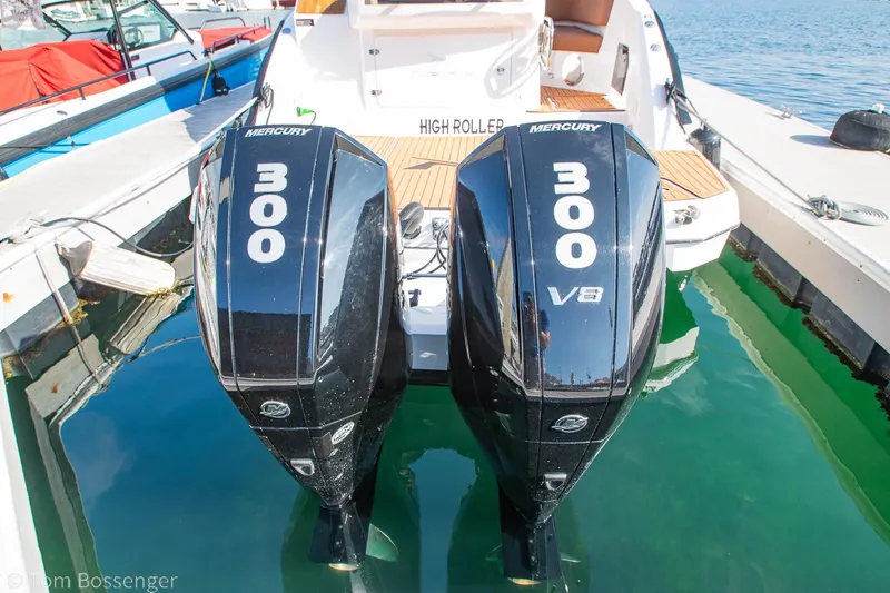 Slide: The Image of Twin Mercury 300 engines on a 2023 NX Boats 340 Sport Coupe. - 31