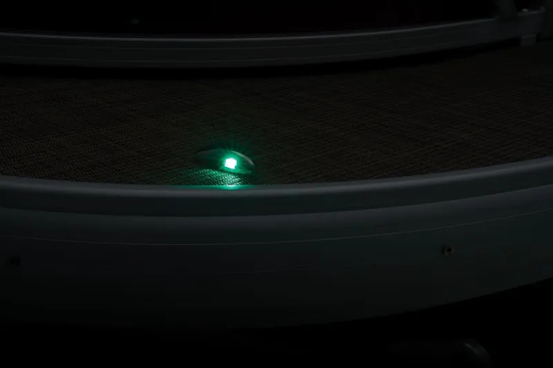 Slide: The Image of 2024 Sun Tracker Party Barge 20 DLX deck with green navigation light. - 48