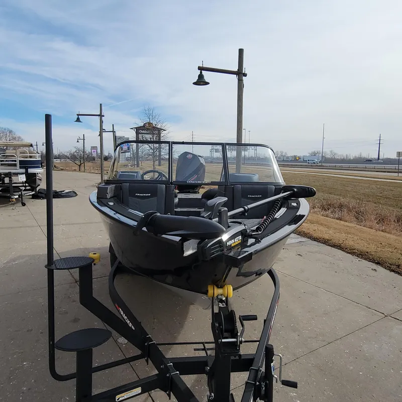 Slide: The Image of 2024 Tracker Targa V-18 WT boat on a trailer, parked outdoors. - 3