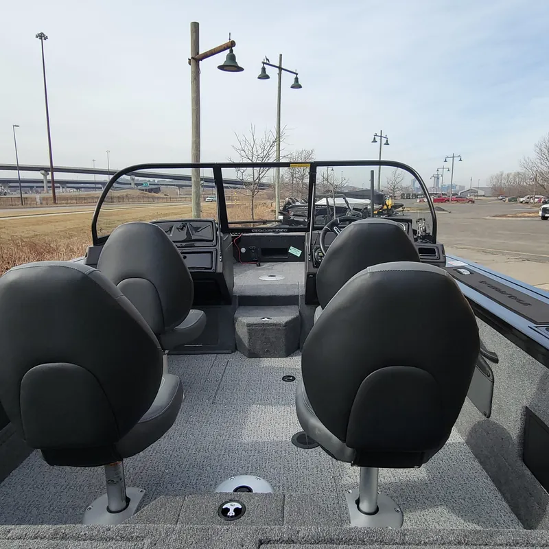 Slide: The Image of 2024 Tracker Targa V-18 WT boat interior with four seats and dashboard. - 6
