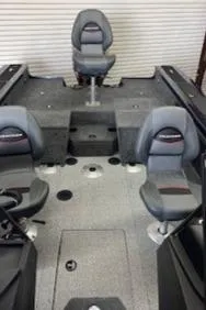 Slide: The Image of 2024 Tracker Targa V-19 Combo boat interior with seating and console. - 15