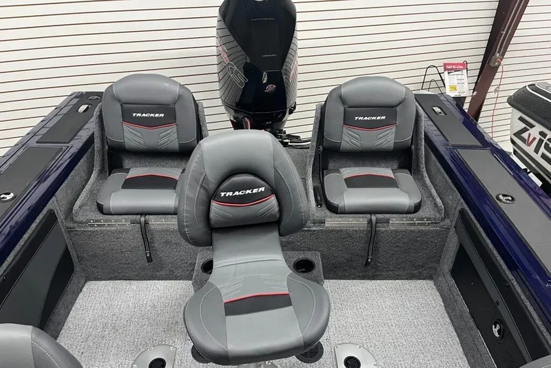 Slide: The Image of 2024 Tracker Targa V-19 Combo boat on display in showroom. - 3