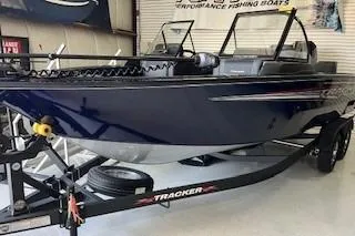 Slide: The Image of 2024 Tracker Targa V-19 Combo boat interior with seating and console. - 4