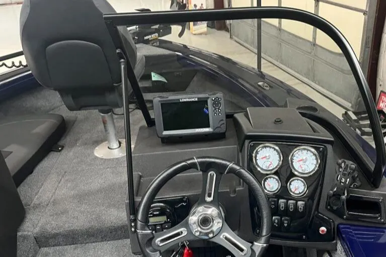 Slide: The Image of 2024 Tracker Targa V-19 Combo boat interior with seating and storage compartments. - 5