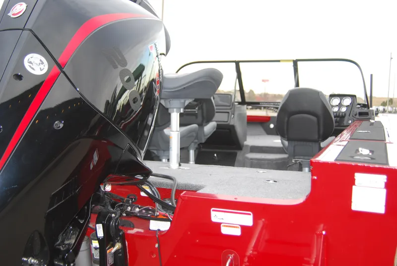 Slide: The Image of 2024 Tracker Targa V-19 WT boat interior with motor and seating. - 4