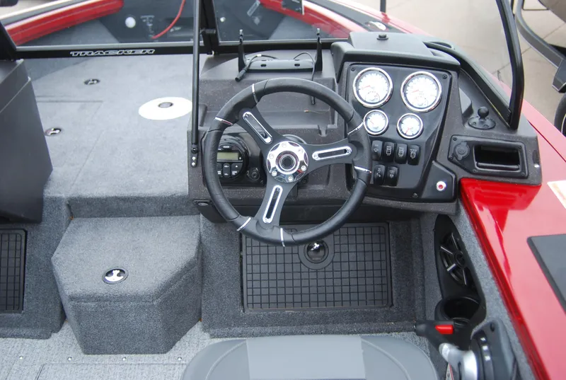 Slide: The Image of 2024 Tracker Targa V-19 WT boat dashboard with steering wheel and instrument panel. - 5
