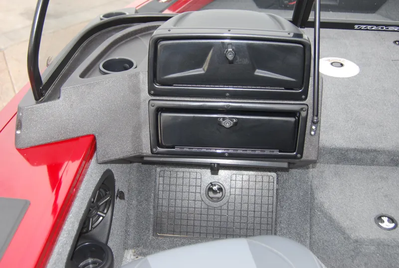 Slide: The Image of 2024 Tracker Targa V-19 WT boat interior dashboard and storage compartments. - 6