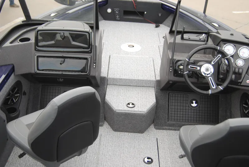Slide: The Image of 2024 Tracker Targa V-19 WT boat interior with steering wheel and seating. - 8