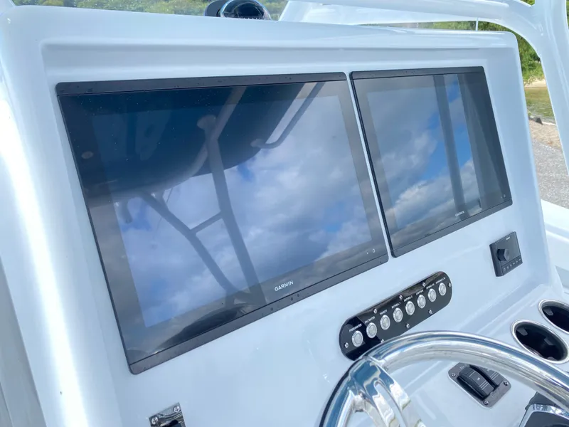 Slide: The Image of 2024 Yellowfin 36 Center Console dual display screens and control panel. - 13