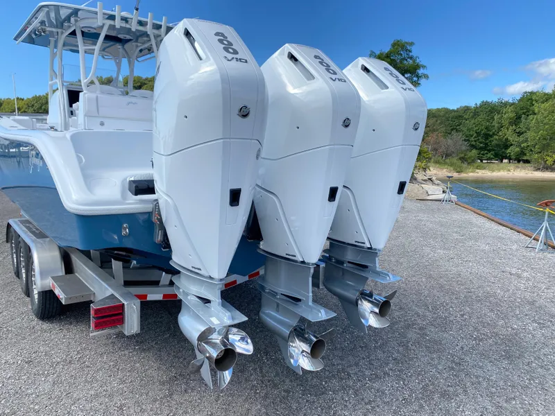 Slide: The Image of 2024 Yellowfin 36 Center Console with triple outboard engines on a trailer. - 4