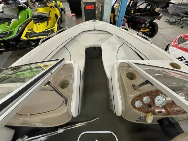 Slide: The Image of 2005 Bayliner Capri 195 boat interior with open bow seating and dashboard. - 10