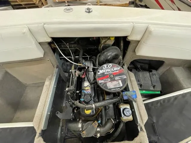 Slide: The Image of 2005 Bayliner Capri 195 boat engine compartment with 3.0L Mercury MerCruiser engine. - 15