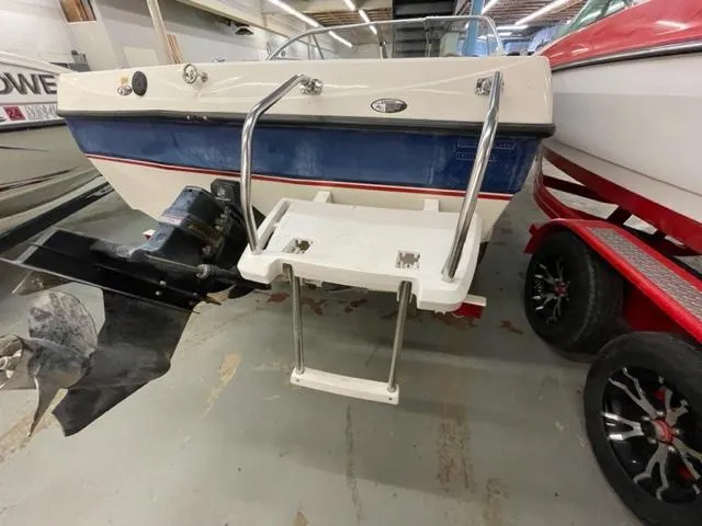 Slide: The Image of 2005 Bayliner Capri 195 boat with swim ladder and outboard motor. - 4