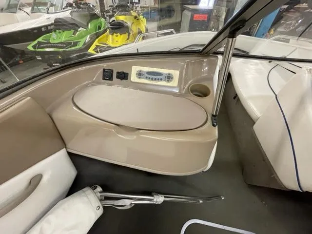 Slide: The Image of Interior of a 2005 Bayliner Capri 195 boat with seating and control panel. - 9