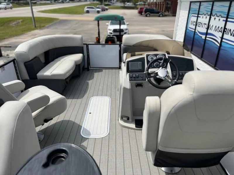 Slide: The Image of 2023 Sylvan Mirage X X1 pontoon boat interior with helm, seating, and modern dashboard. - 4