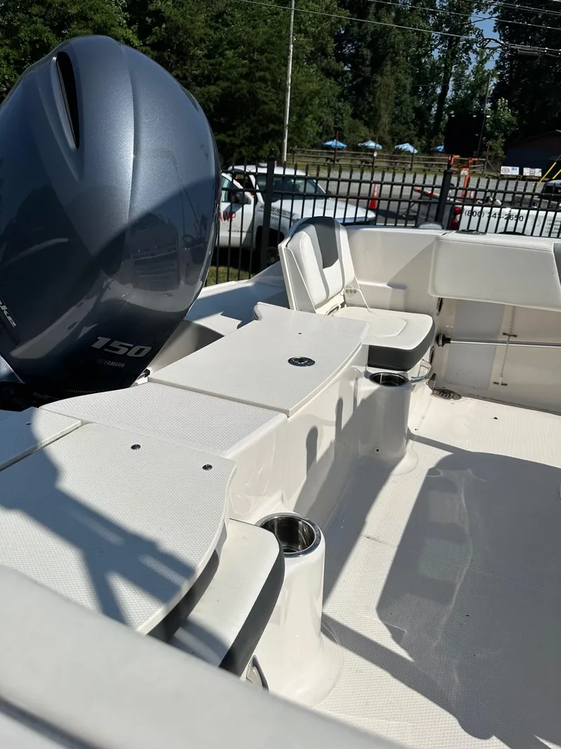Slide: The Image of 2023 Robalo R180 Center Console boat interior with Yamaha 150 outboard motor. - 5