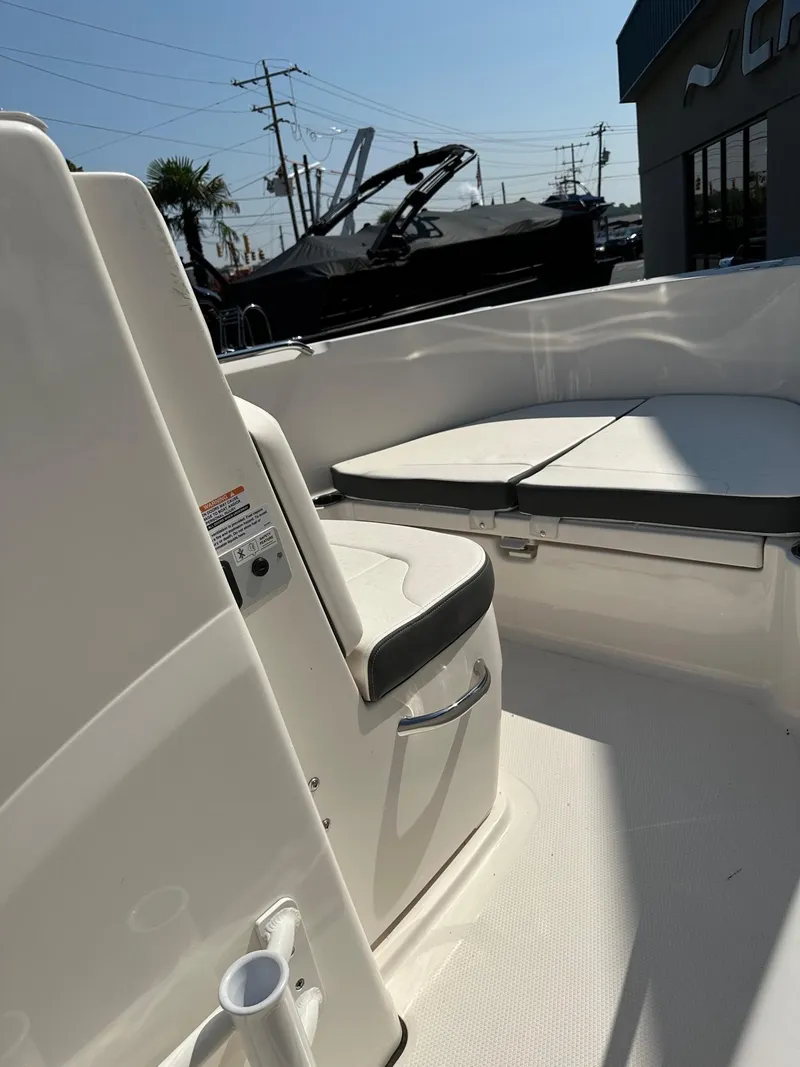 Slide: The Image of 2023 Robalo R180 Center Console boat interior with seating and storage. - 6