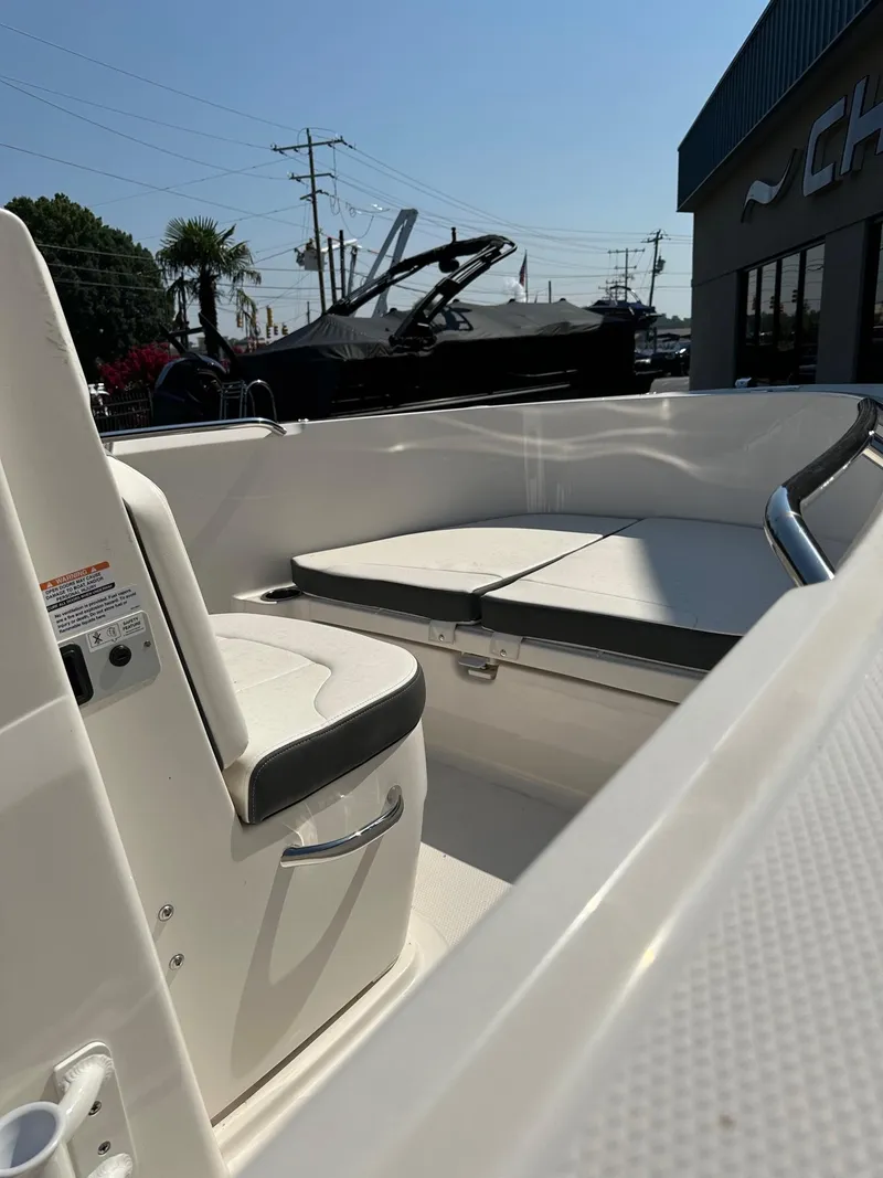 Slide: The Image of 2023 Robalo R180 Center Console boat interior with seating and console. - 7