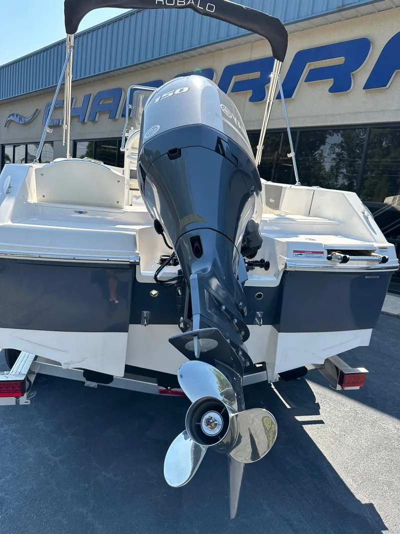Slide: The Image of 2023 Robalo R180 Center Console boat with outboard motor. - 8