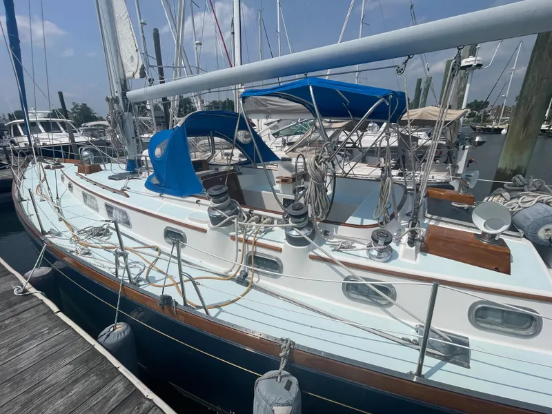 Slide: The Image of 1983 Bristol 45.5 Center Cockpit sailboat docked at marina. - 10