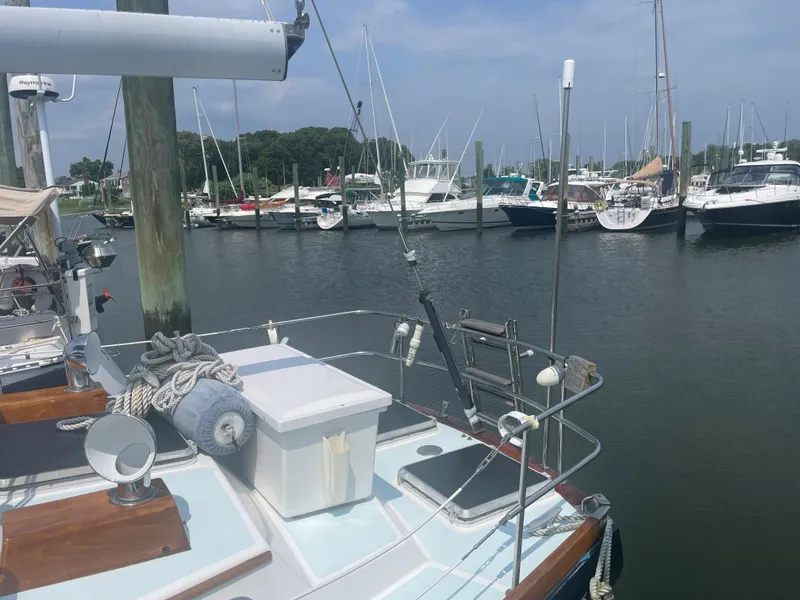 Slide: The Image of 1983 Bristol 45.5 Center Cockpit sailboat docked in a marina. - 12