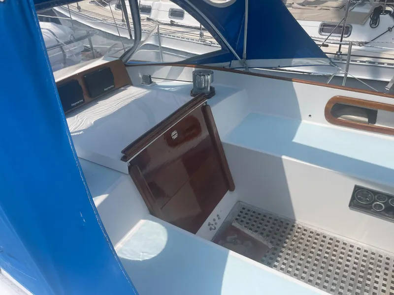 Slide: The Image of 1983 Bristol 45.5 Center Cockpit with blue canopy and wooden hatch. - 15