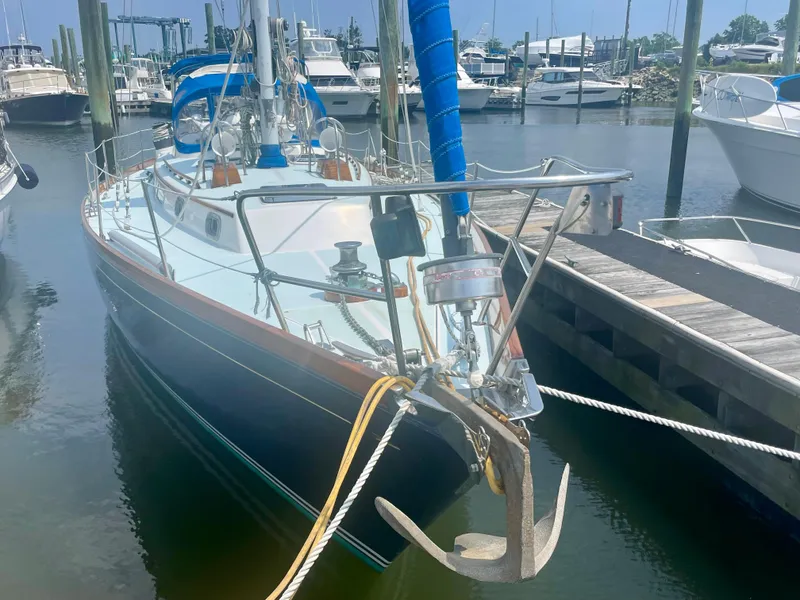 Slide: The Image of 1983 Bristol 45.5 Center Cockpit sailboat docked in a marina. - 3