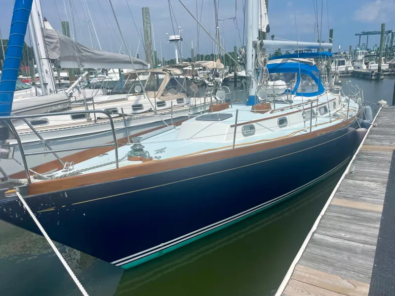 Slide: The Image of 1983 Bristol 45.5 Center Cockpit sailboat docked at a marina. - 4