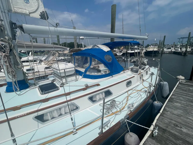 Slide: The Image of 1983 Bristol 45.5 Center Cockpit sailboat docked at marina. - 8
