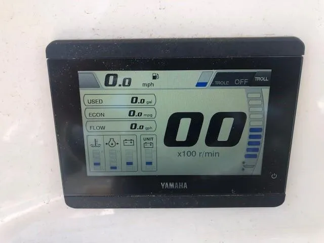 Slide: The Image of Yamaha display on 2023 NauticStar 24 XS boat showing speed, fuel, and RPM. - 17