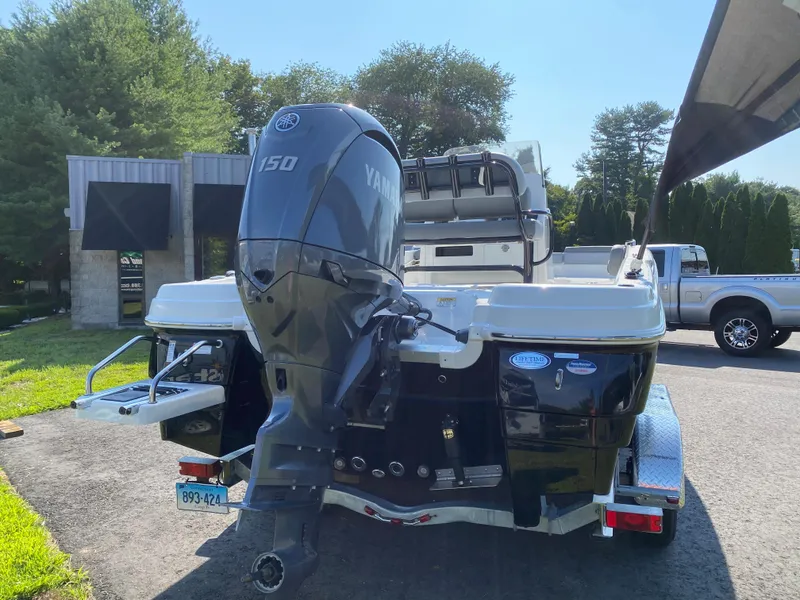 Slide: The Image of 2024 NauticStar 211 Hybrid boat with Yamaha 150 outboard motor. - 5