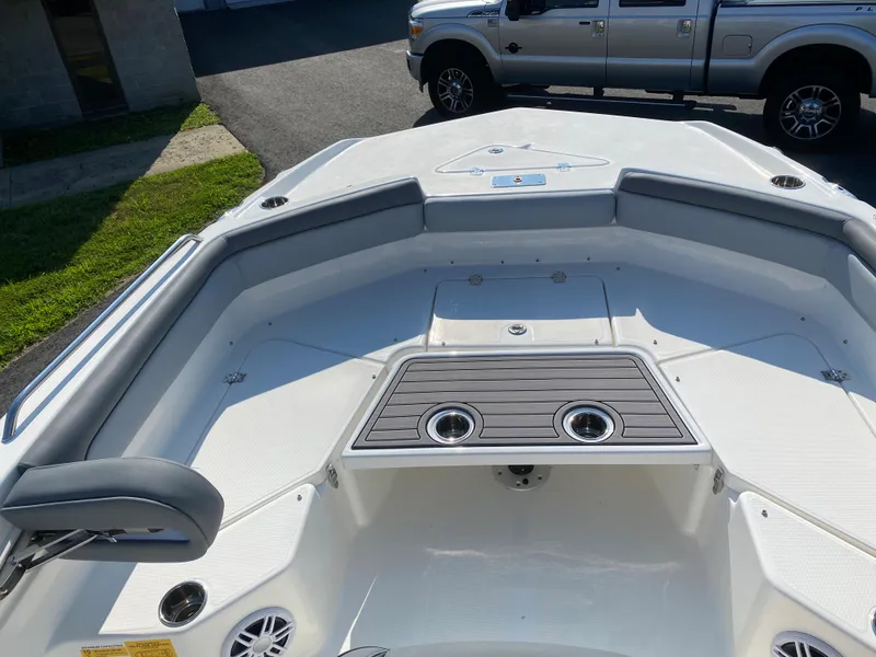 Slide: The Image of 2024 NauticStar 211 Hybrid boat bow seating area with cup holders. - 7