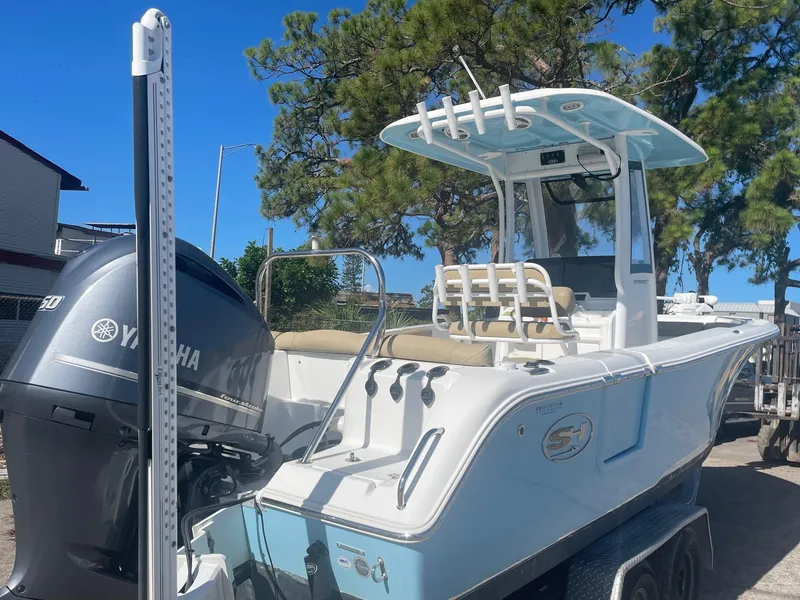 Slide: The Image of 2018 Sea Hunt Ultra 235 SE boat with Yamaha engine on trailer. - 2