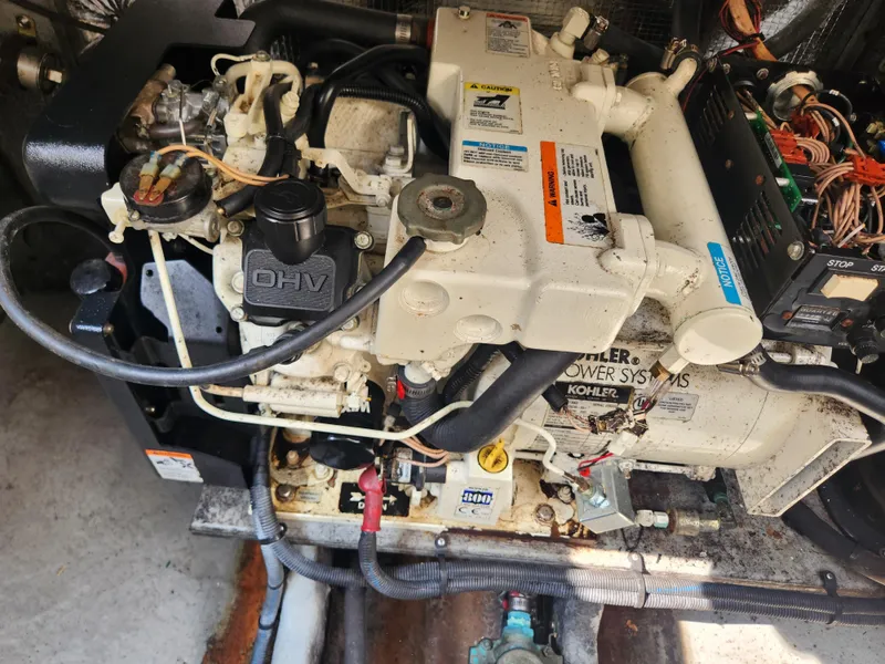 Slide: The Image of 2004 Sea Ray 290 Amberjack engine compartment with Kohler power systems. - 14
