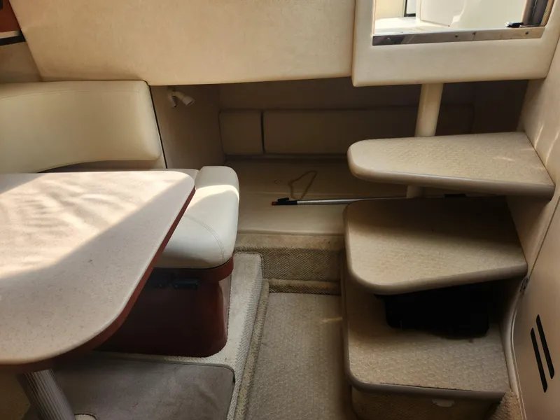 Slide: The Image of Interior of 2004 Sea Ray 290 Amberjack boat with seating and steps. - 15