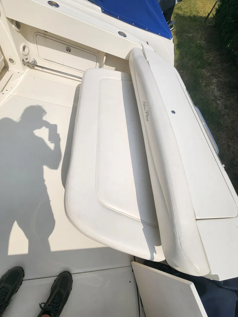 Slide: The Image of 2004 Sea Ray 290 Amberjack boat interior with white seating. - 23