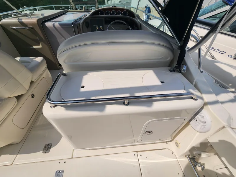 Slide: The Image of 2004 Sea Ray 290 Amberjack boat interior with helm seat and dashboard. - 24