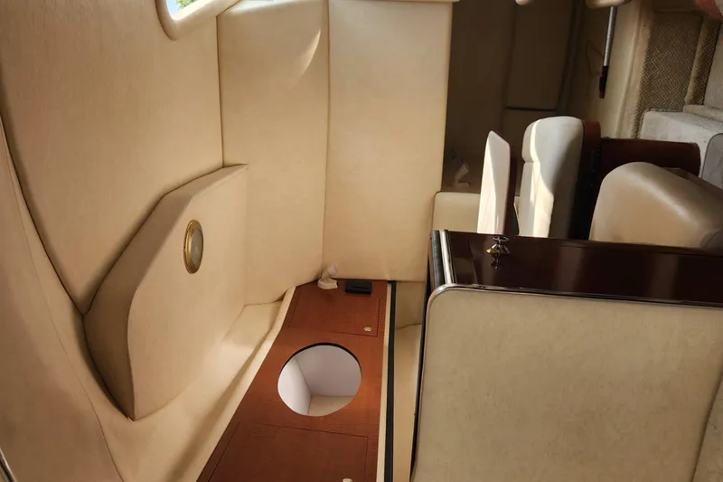 Slide: The Image of Interior cabin of a 2004 Sea Ray 290 Amberjack boat with beige upholstery. - 41