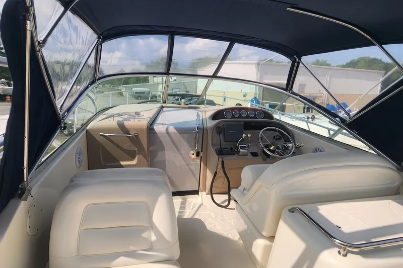 Slide: The Image of 2004 Sea Ray 290 Amberjack boat interior with helm and seating. - 43