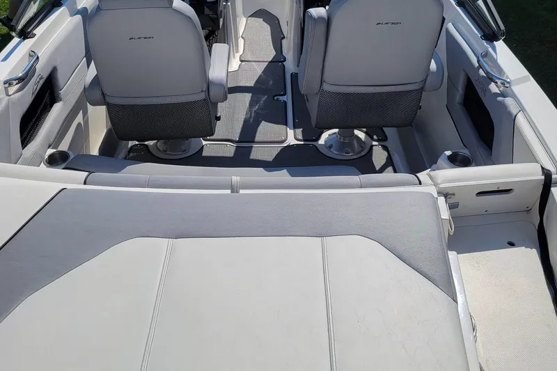Slide: The Image of 2014 Larson LSR 2100 I/O boat interior with seating and storage compartments. - 5