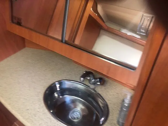 Slide: The Image of 2008 Hunter 41 Deck Salon bathroom sink and mirror - 15