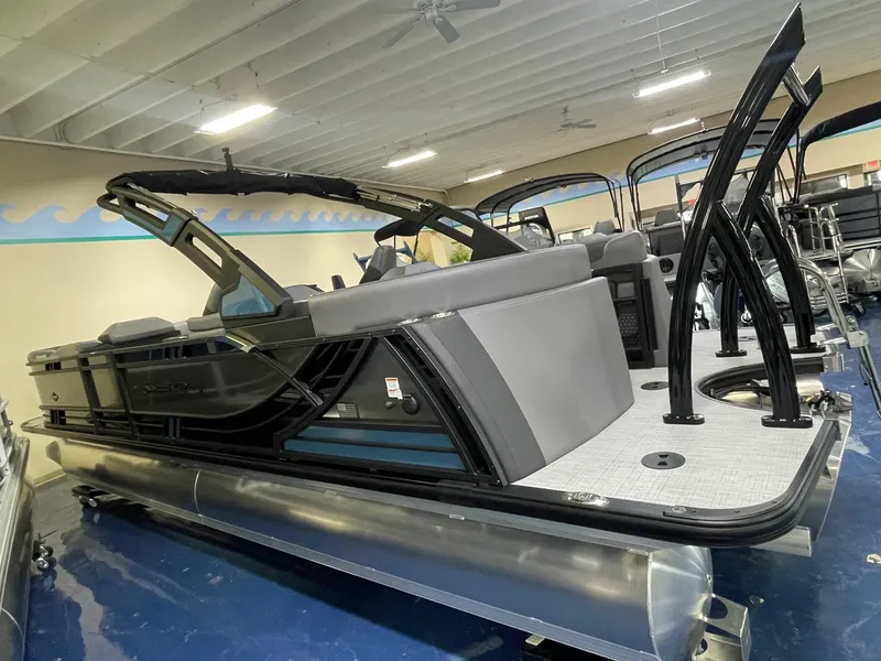 Slide: The Image of 2026 South Bay 525 RS 3.0 Arch pontoon boat in showroom, featuring sleek design and modern amenities. - 3
