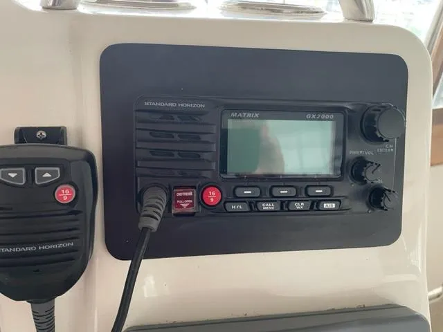 Slide: The Image of Standard Horizon Matrix GX2000 radio on 1999 Silverton 392 Motor Yacht dashboard. - 19